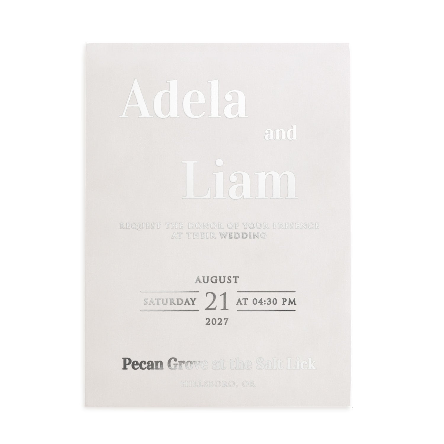 A semi-transparent vellum wedding invitation with sophisticated silver foil details. The sleek metallic lettering enhances the minimal design, giving the invitation a refined, contemporary elegance suitable for luxury weddings – XOXOKristen.