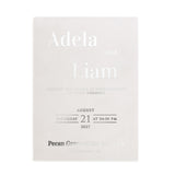A semi-transparent vellum wedding invitation with sophisticated silver foil details. The sleek metallic lettering enhances the minimal design, giving the invitation a refined, contemporary elegance suitable for luxury weddings – XOXOKristen.