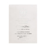 XOXOKristen translucent vellum invitation card with silver foil lettering for quinceañera, styled with soft shadows and floral decor for modern minimalist aesthetic.