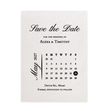 Elegant “Save the Date” wedding card printed in classic black ink on matte white cardstock, featuring minimalist calendar layout and modern serif fonts – XOXOKristen