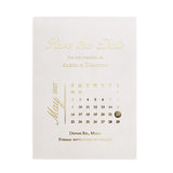 Gold-foiled “Save the Date” wedding card with elegant calendar design and luxurious script typography, printed on translucent vellum – XOXOKristen
