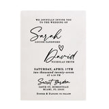 A personalized vellum wedding invitation card printed in rich matte black ink, featuring elegant modern calligraphy combined with clean serif typography. The translucent vellum surface gives a soft frosted appearance, allowing subtle light to pass through while keeping the text crisp and readable. The design layout includes the couple’s names in flowing cursive with a small heart between them and the wedding details below. Perfect for couples seeking minimalist luxury wedding stationery. – XOXOKristen