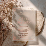 Rose gold foil vellum baptism invitation photographed on soft stone with dried flowers and warm light, an elegant and personalized design for sacred celebrations – XOXOKristen