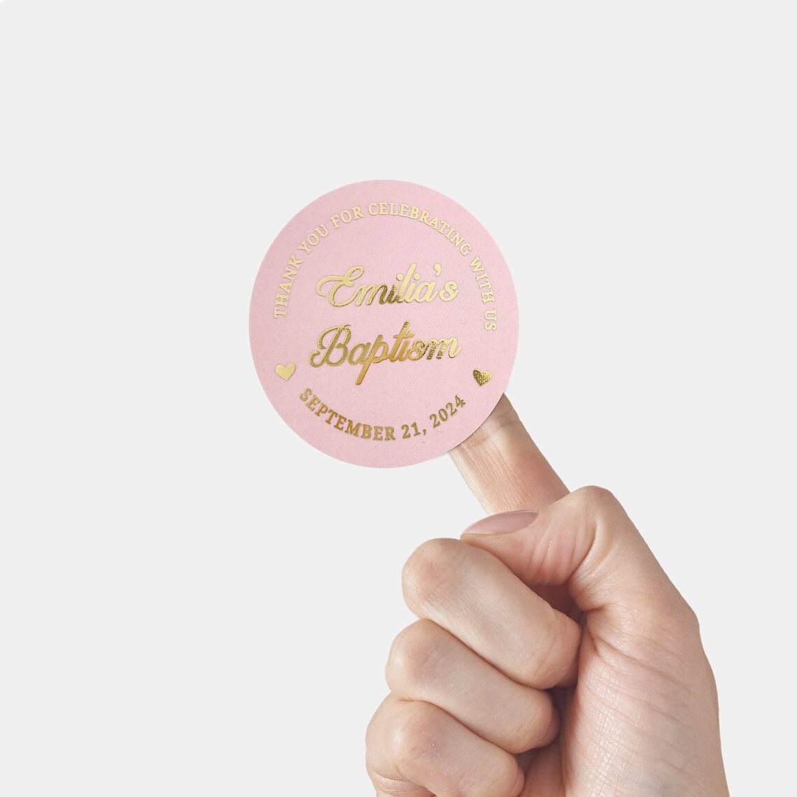 personalized pink and gold baptism stickers with named and date, and text reading Thank you for celebrating with us. 