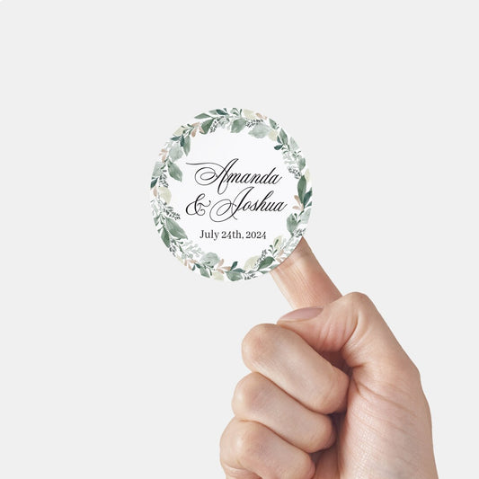 Elegant wedding sticker with genery wreath, personalized with names and wedding date. 