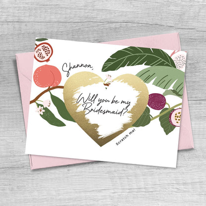 personalized bridesmaid proposal card with custom name, tropical design and gold foiled scratch off heart.