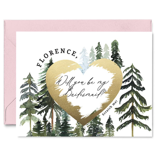 will you be my bridesmaid proposal card with rustic pine trees design and gold foiled cratch off heart in the middle. 