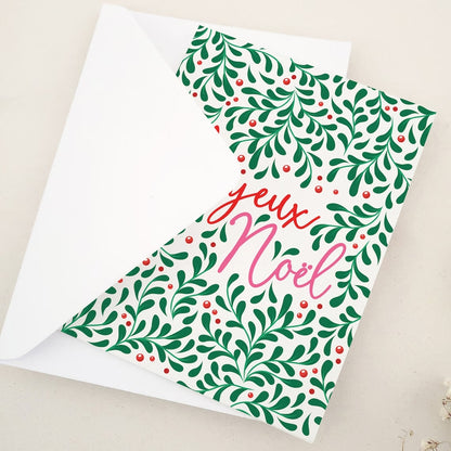 Festive 'Joyeux Noël' Holiday Card with Green and Red Botanical Design