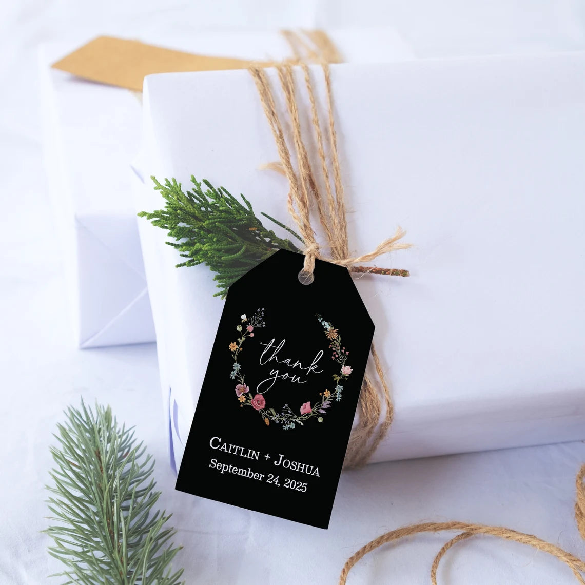 Sophisticated black wedding favor tags with watercolor wildflowers wreath.