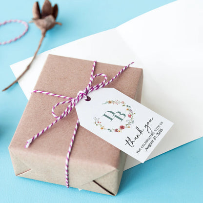 Elegant personalized monogram wedding favor tags with watercolor wildflowers wreath.
