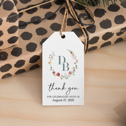 Elegant personalized monogram wedding favor tags with watercolor wildflowers wreath.