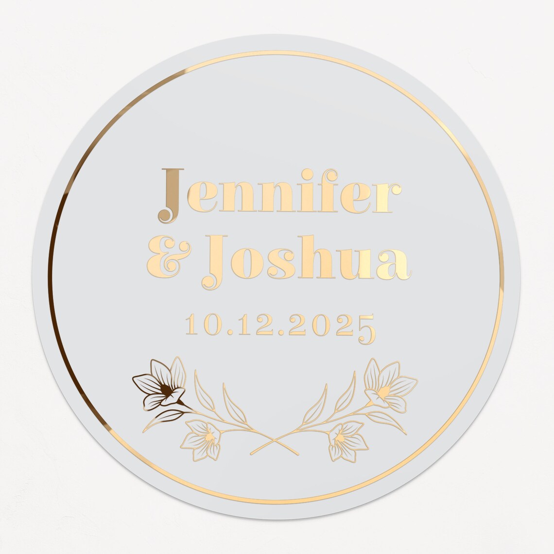 Personalized wedding sticker with bold names, date, and floral branches on clear background