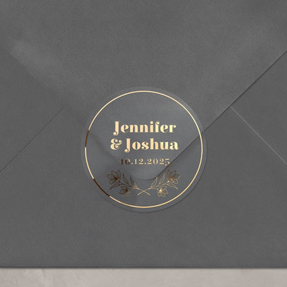 Personalized wedding sticker with bold names, date, and floral branches on clear background