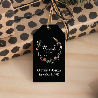 Sophisticated black wedding favor tags with watercolor wildflowers wreath.