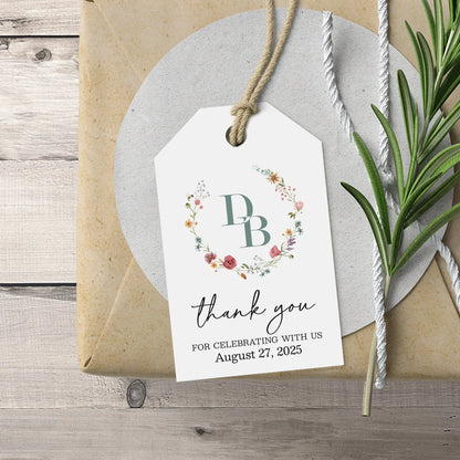 Elegant personalized monogram wedding favor tags with watercolor wildflowers wreath.