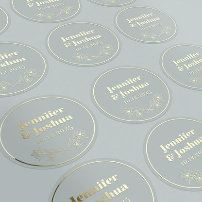 Personalized wedding sticker with bold names, date, and floral branches on clear background
