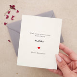 Greeting card with modern script “mom” and heartfelt birthday message, decorated with small red heart, styled with burgundy envelope — XOXOKristen.
