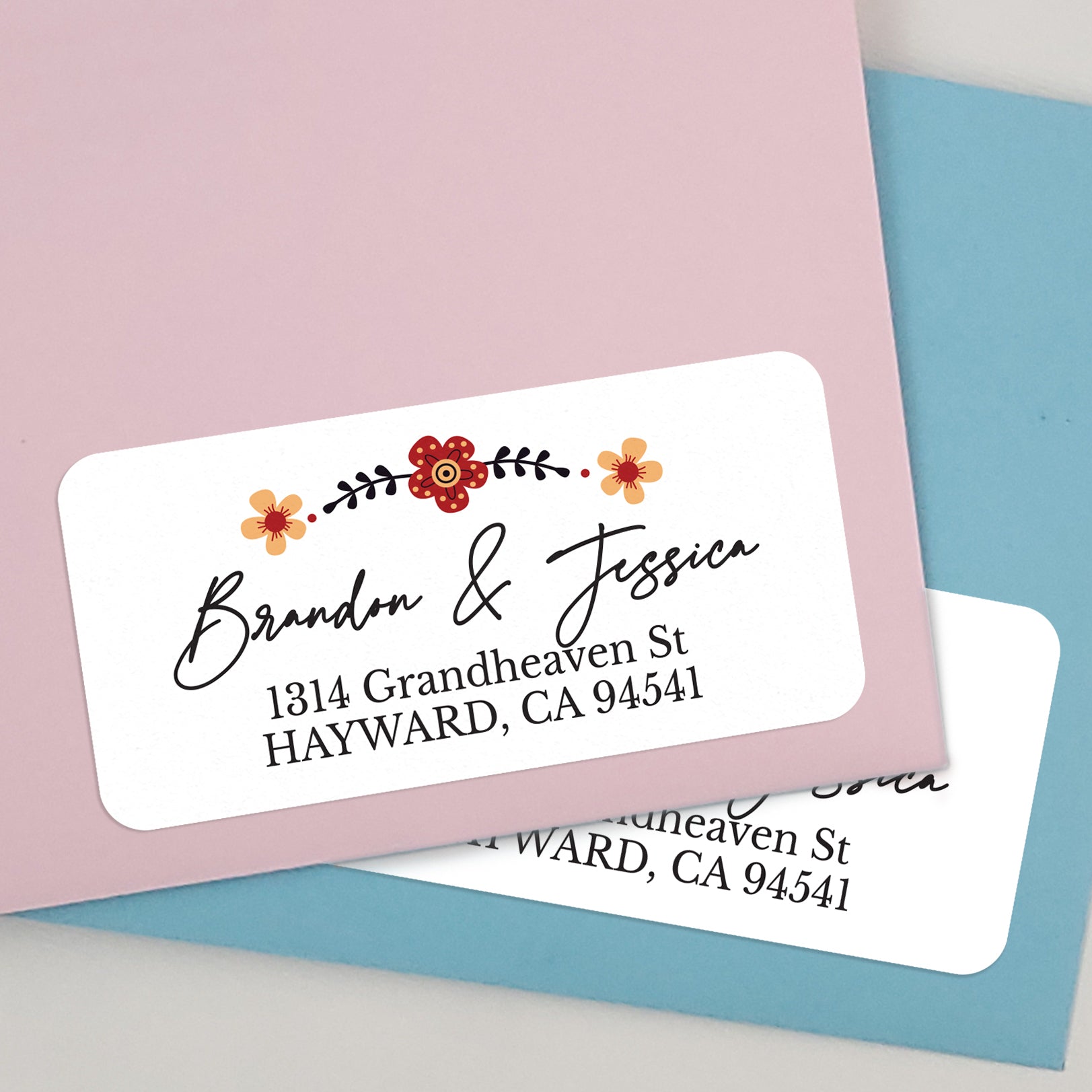 white floral return address labeld with red and orange flower design - XOXOKristen