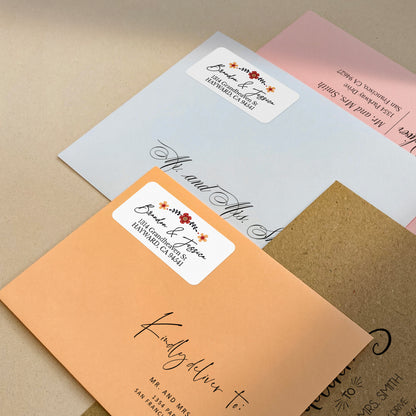 white floral return address labeld with red and orange flower design - XOXOKristen