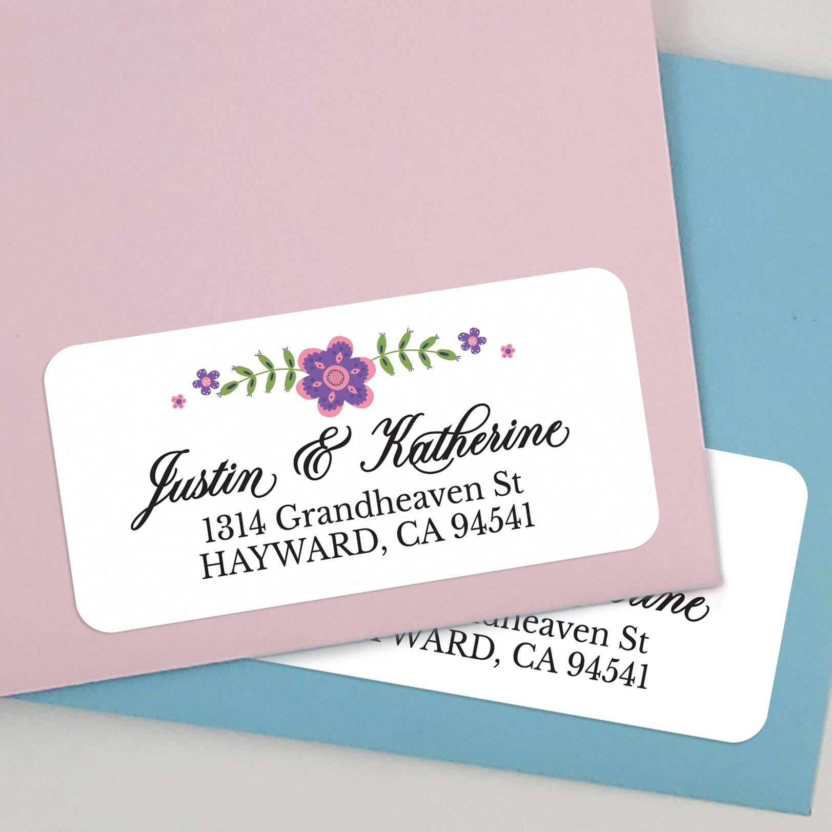 Close-up of personalized white background return address label featuring pink and purple flowers and greenery - XOXOKristen