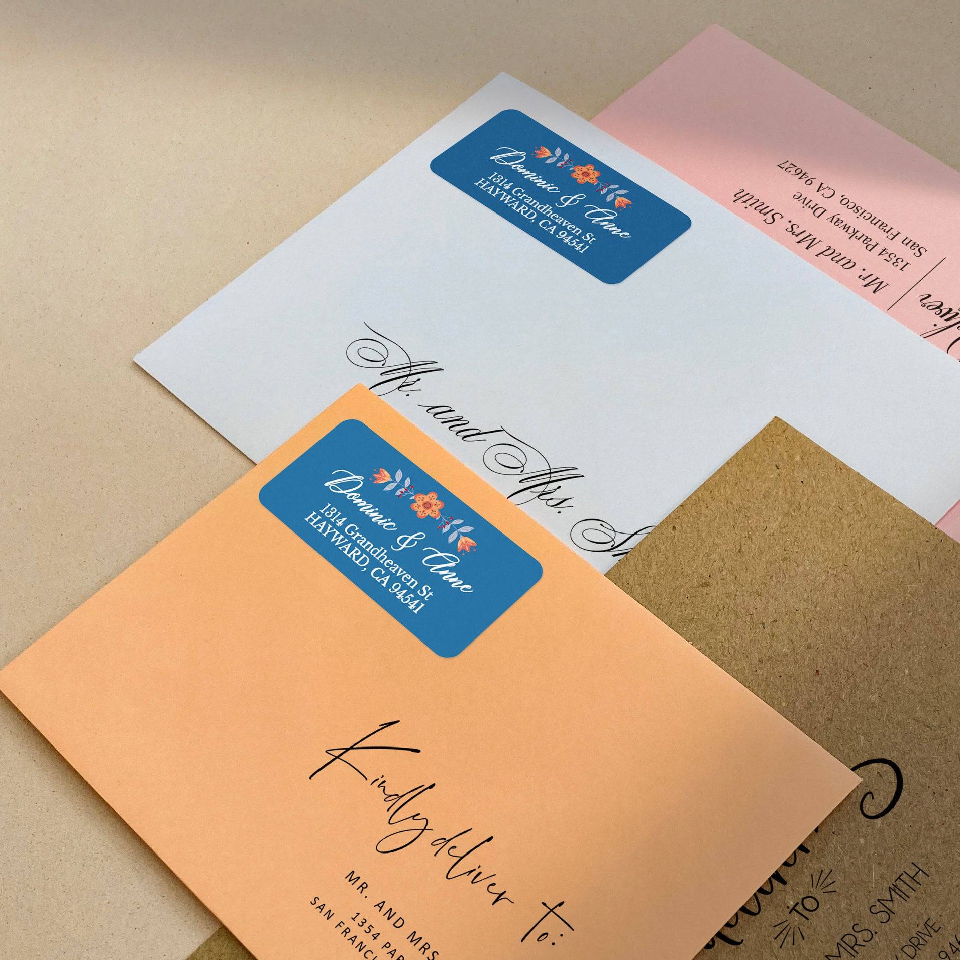 Blue background return address label featuring floral orange blossom with leafy details and custom white calligraphy - XOXOKristen