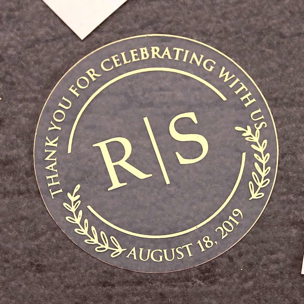 Custom wedding thank you sticker with monogram initials and real gold foiled lettering. Entirely personalized clear labels.
