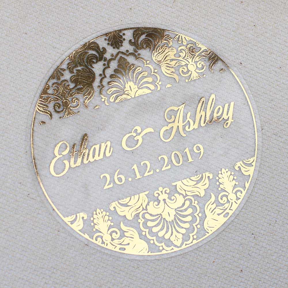Custom wedding sticker with ornaments and gold foiled lettering. Entirely personalized clear labels.  