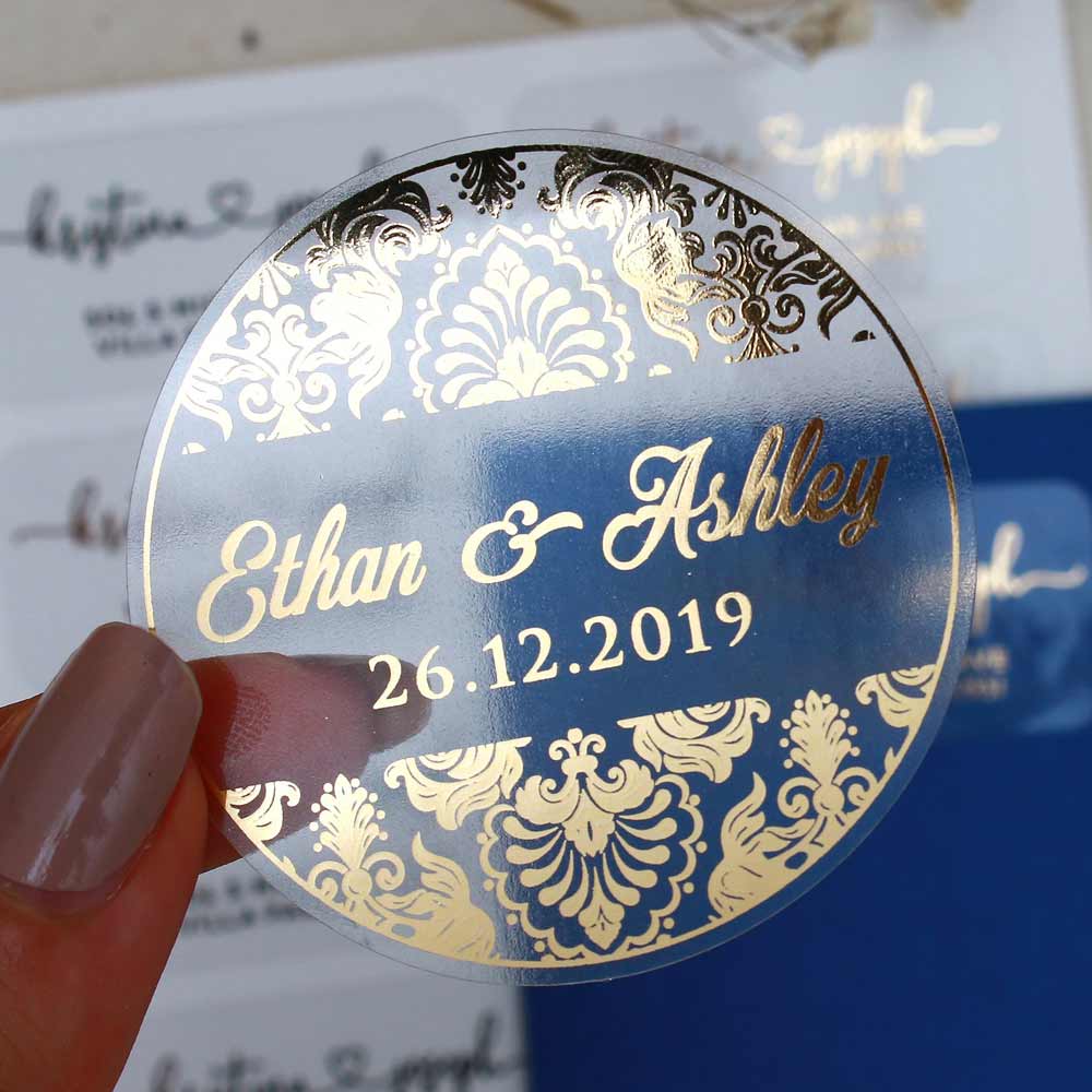 Custom wedding sticker with ornaments and gold foiled lettering. Entirely personalized clear labels.  