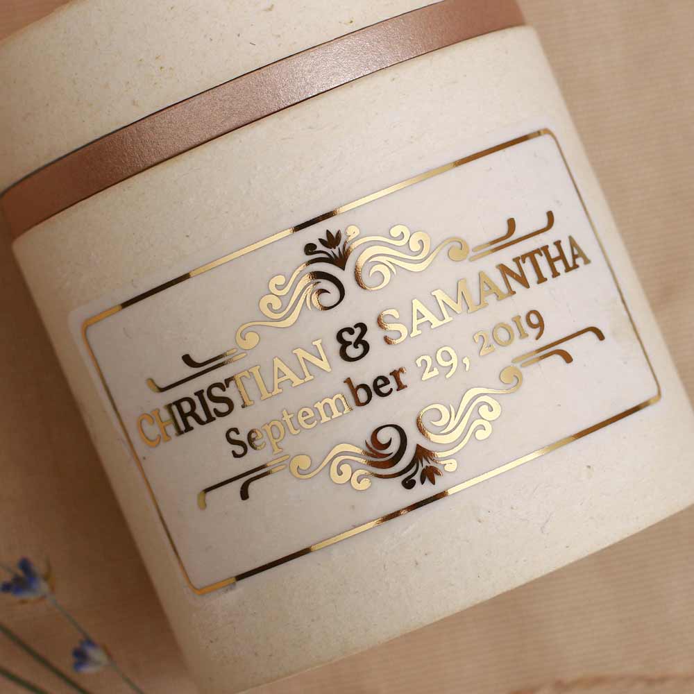 Custom wedding sticker with ornaments and rectangular design. Entirely personalized clear gold foiled label.