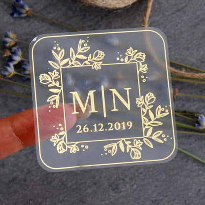 Custom wedding sticker with monogram initials and floral design. Entirely personalized clear labels.