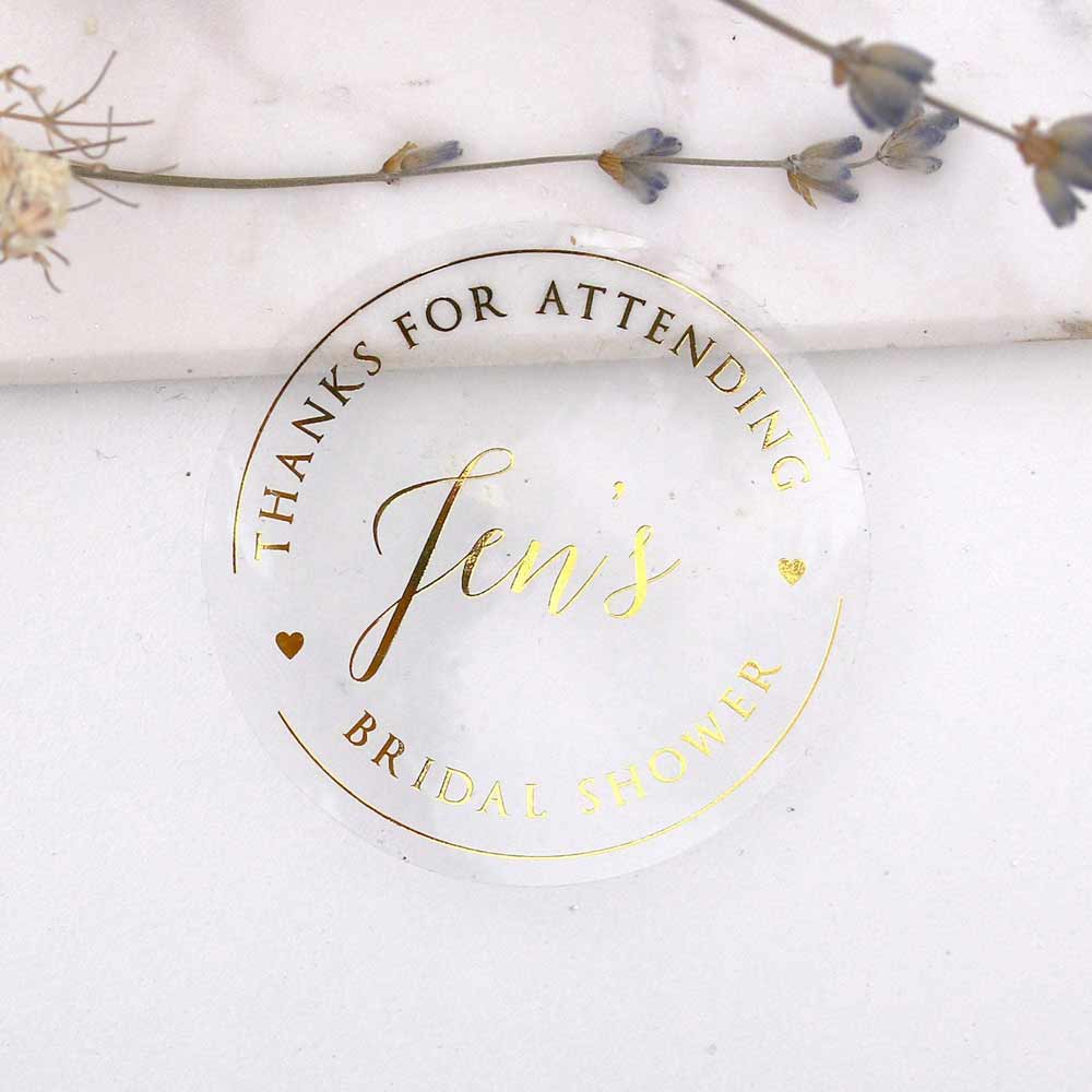 Custom gold foiled bridal shower stickers with hearts and real gold foil lettering. Entirely personalized clear labels.  