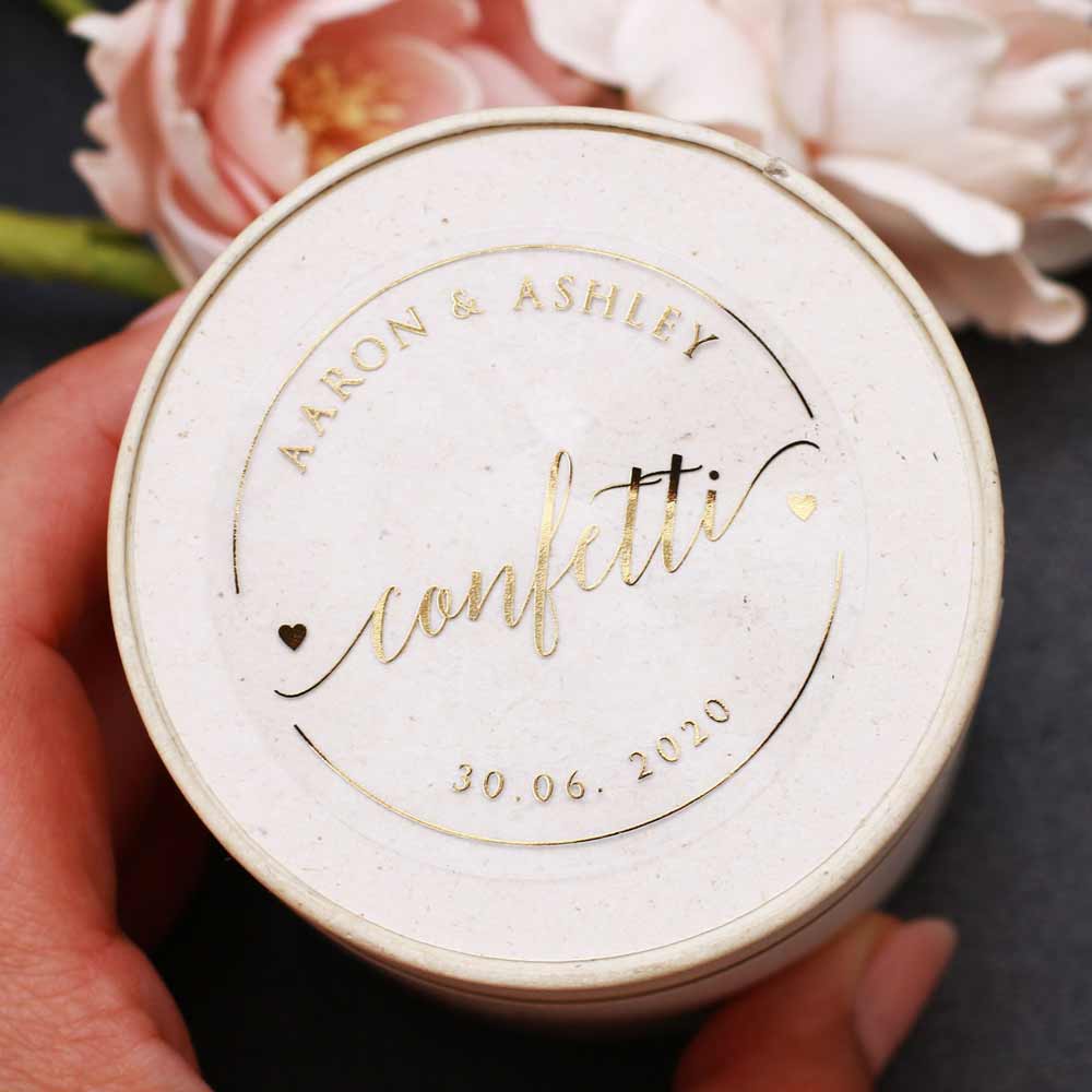 Custom gold foiled wedding confetti sticker with real gold foil lettering. Entirely personalized clear labels. 