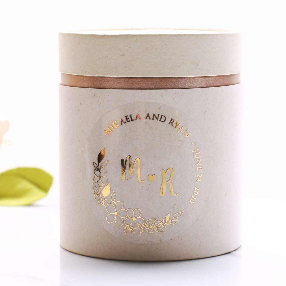Custom wedding sticker with real gold foiled lettering and flower ornament. Entirely personalized clear labels.