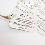 XOXOKristen Greenery Wedding Thank You Tag placed on soft beige fabric — minimalist botanical design, personalized and custom tag for weddings.