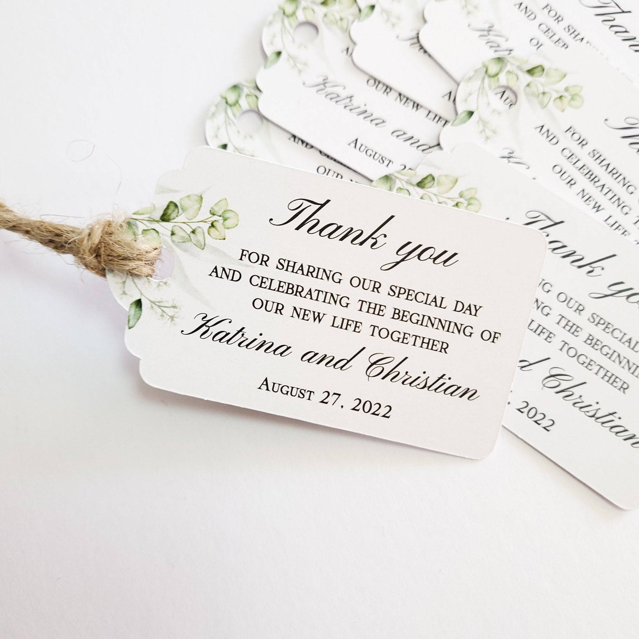 XOXOKristen Greenery Wedding Thank You Tag placed on soft beige fabric — minimalist botanical design, personalized and custom tag for weddings.