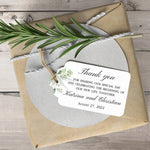 XOXOKristen Greenery Wedding Thank You Tag placed on soft beige fabric — minimalist botanical design, personalized and custom tag for weddings.