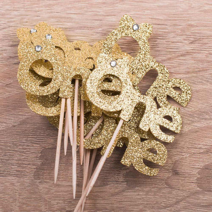 gold glitter first birthday cupcake decoration with cute bow - xoxokristen