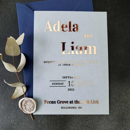 Elegant vellum wedding invitations with gold foiled writing - XOXOKristen 
