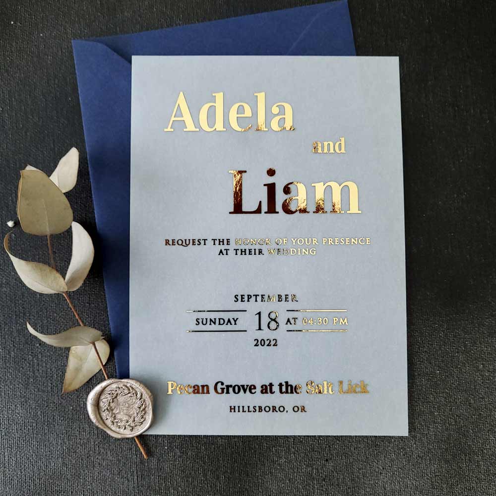 Elegant vellum wedding invitations with gold foiled writing - XOXOKristen 