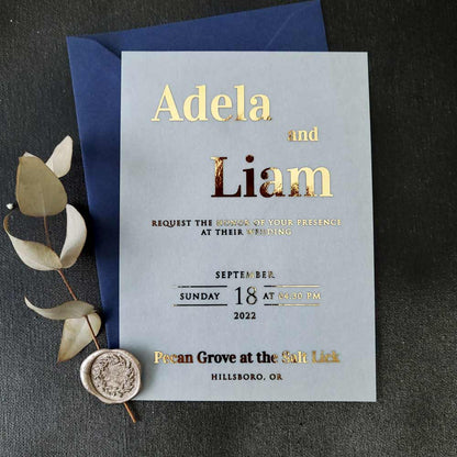 Elegant vellum wedding invitations with gold foiled writing - XOXOKristen 