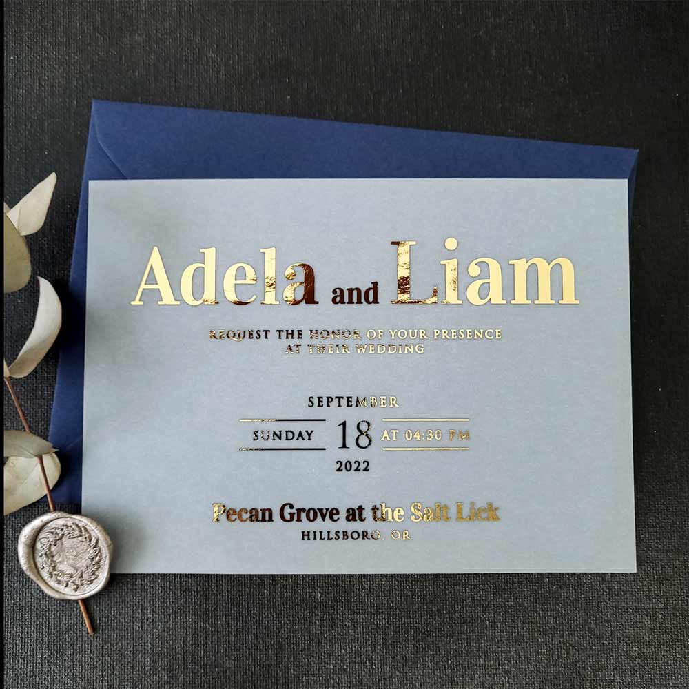 Elegant vellum wedding invitations with gold foiled writing - XOXOKristen 