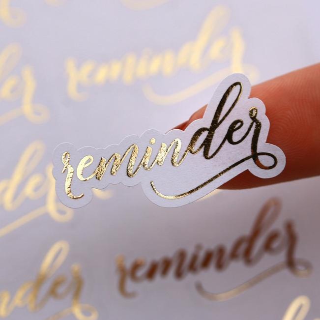 Gold foiled agenda planner stickers saying Reminder - XOXOKristen