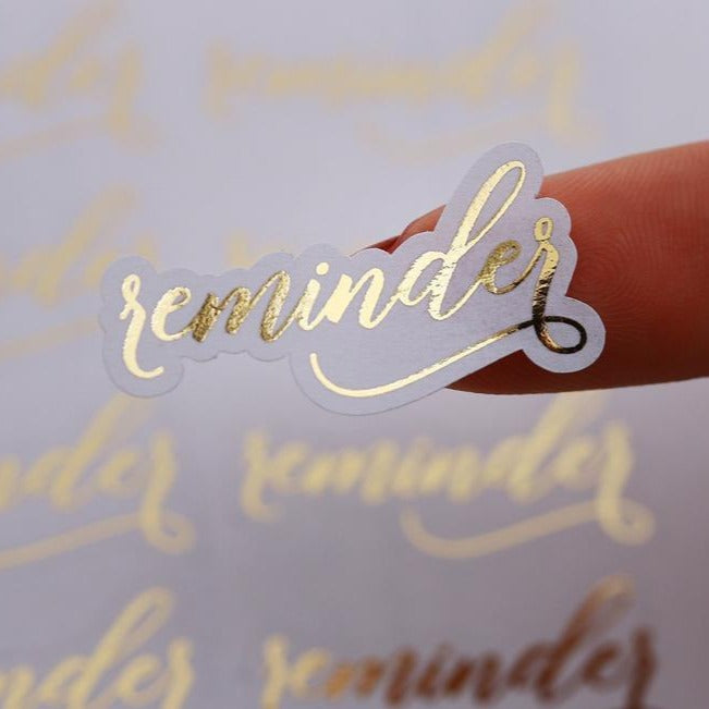 Gold foiled agenda planner stickers saying Reminder - XOXOKristen