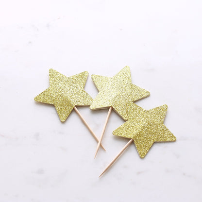 Gold glittered star-shaped cupcake topper for unique party decoration - XOXOKristen