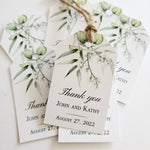 XOXOKristen Eucalyptus Branch Thank You Tags printed with watercolor eucalyptus leaves and delicate greenery, featuring the static “Thank you” text in elegant black script on matte white cardstock.